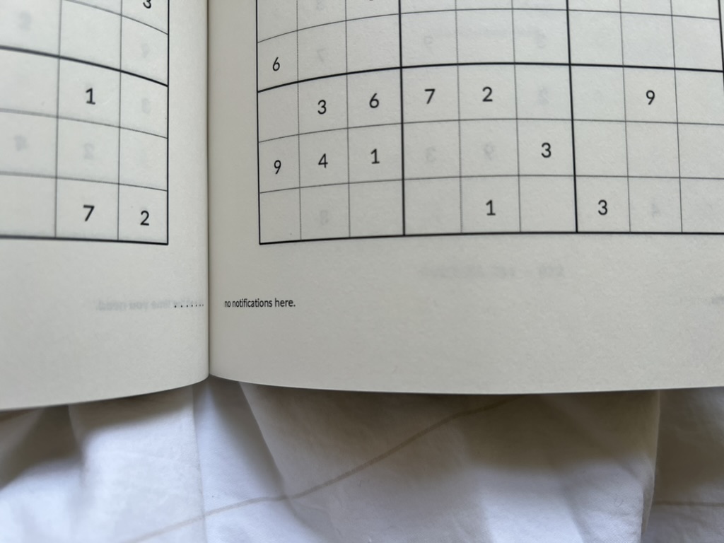 Close view of printed Sudoku puzzles and the words no notifications here